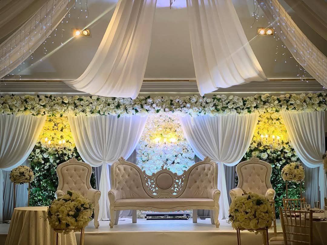 White Floral Wedding Stage Decoration with Draping & Ambient Lighting